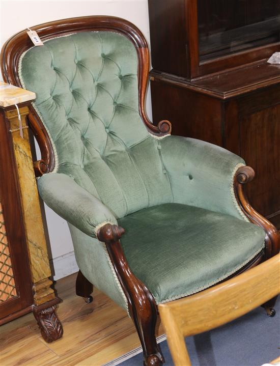 A Victorian buttoned-back armchair and a similar chair